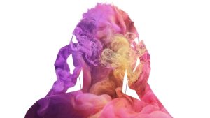 Silhouette of a person holding their head with swirling colorful smoke around them