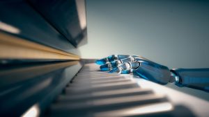 A robotic hand is positioned over the keys of a piano